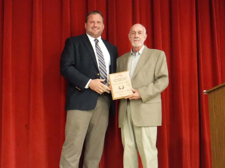 The Apollo Spring Church Sportsmen's Club Inc accepts the award for Outstanding Forestry presented by Commissioner Jason Renshaw
